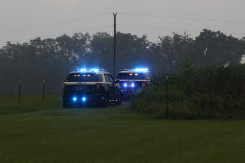 A pair of Florida Highway Patrol vehicles are parked during a search in the King Road and Dyal Avenue area Wednesday afternoon. (MORGAN MCMULLEN/Lake City Reporter)