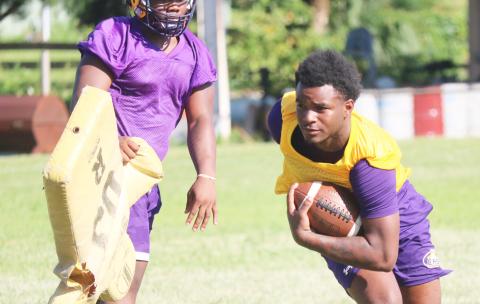Columbia receiver Tray Tolliver runs after making a catch during Tuesday’s practice. (JORDAN KROEGER/Lake City Reporter)