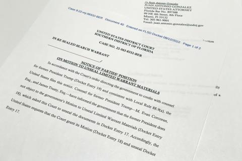 The notice filed by the Justice Department to the U.S. District Court South District of Florida informing the judge that lawyers for former President Donald Trump did not object to the government's motion to unseal the search warrant for Trump's Mar-a-Lago estate, is photographed Friday. (JON ELWICK/Associated Press)