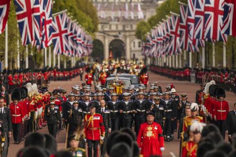 The coffin of Queen Elizabeth II is pulled past Buckingham Palace following her funeral service in Westminster Abbey in central London on Monday. (VADIM GHIRDA/Associated Press)