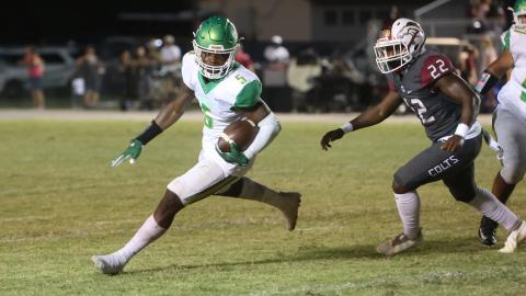 Suwannee running back Brandon Robinson takes a carry up the field against North Marion on Friday. (PAUL BUCHANAN/Special to the Reporter)