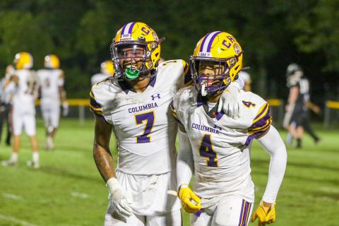 Columbia cornerback Amare Ferrell (7) and receiver Dailyn Bradley (4) celebrate after Bradley’s touchdown catch against Buchholz on Aug. 25. (BRENT KUYKENDALL/Lake City Reporter)
