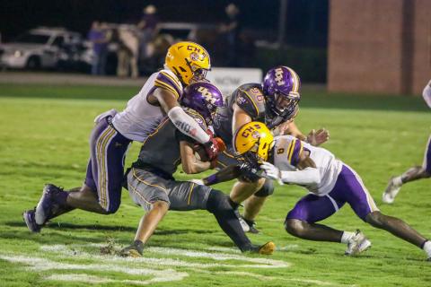 Columbia High linebacker Tyrell Peterson (left) and defensive back Jaylen Cooper converge on a Union County ballcarrier last week. The Tigers are looking to pick up their first win of the season when Deland visits Tiger Stadium tonight. (BRENT KUYKENDALL/Lake City Reporter)