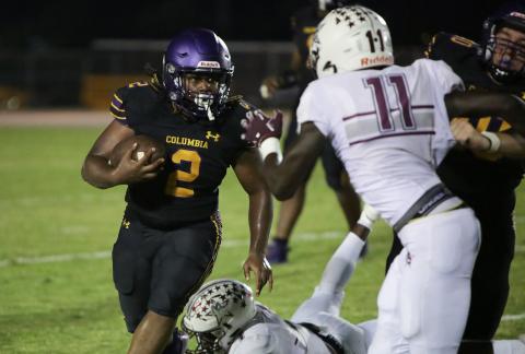 Columbia running back Tony Fulton carries the ball up the field against Madison County on Friday. (BRENT KUYKENDALL/Lake City Reporter)