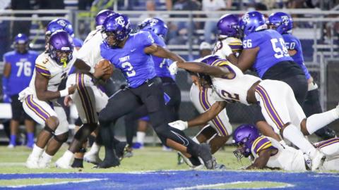 Trinity Christian running back Treyaun Webb runs past Columbia linebacker Au’vontae Smith during Friday night’s game. (BRENT KUYKENDALL/Lake City Reporter)