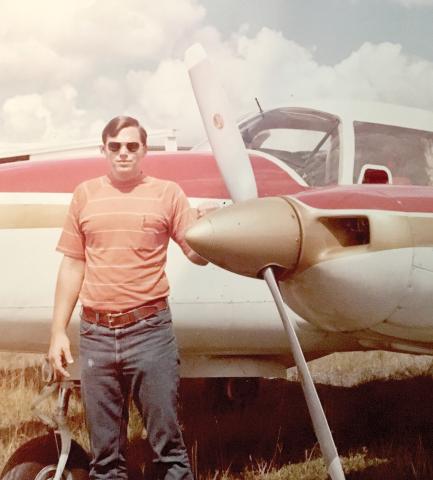 Billy Dekle stands with a Piper Aztec plane in the late 1970s when he began flying trips to Central and South America to bring marijuana to Florida as part of a smuggling operation, which he has written about in ‘Flying High with Gringo Billy.’ (COURTESY)