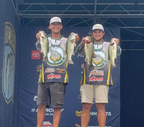 Seth Slanker (left) and Jackson Swisher show off their catches at the 2022 Strike King Bassmaster College Series National Championship. (COURTESY FGC)