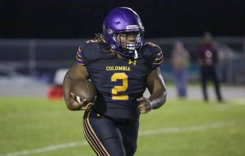 Columbia running back Tony Fulton rushes up the field against Madison County on Friday. (BRENT KUYKENDALL/Lake City Reporter)