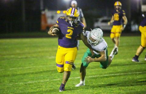 Columbia running back Tony Fulton races past a DeLand defender on Friday. (BRENT KUYKENDALL/Lake City Reporter)
