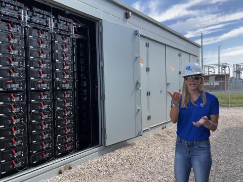Stevany Cole, a project developer with Florida Power & Light, speaks about the battery storage technology utilized at the Echo River Solar Energy Center in Suwannee County on Thursday. (JAMIE WACHTER/Lake City Reporter)