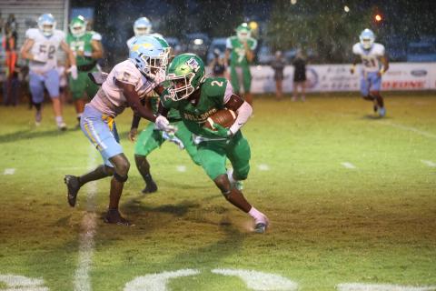 Suwannee wide receiver Jay Smith spins away from Chiefland defender Anthony Blackman at Langford Stadium on Friday night. (PAUL BUCHANAN/Special to the Reporter)