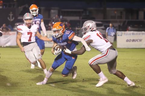Branford receiver Austin Malaguti tries to escape a tackle against Williston on Friday. (PAUL BUCHANAN/Special to the Reporter)