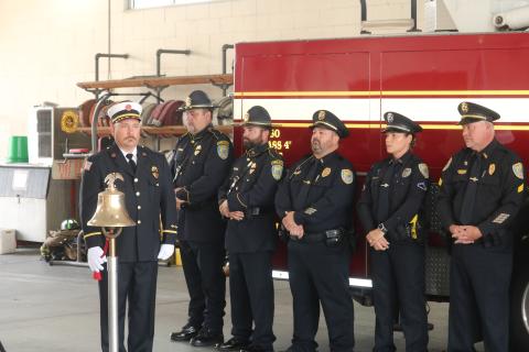 Lt. Robert Oliver, a Lake City Fire Department firefighter, rings a bell to commemorate the moments when airliners crashed into the World Trade Center Buildings during a Patriot Day Memorial Ceremony on Friday morning. (TONY BRITT/Lake City Reporter)