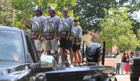 Florida Gateway College’s national runner-up fishing duo Jackson Swisher (from left) and Seth Slanker wave with teammates during a parade on the college campus Thursday celebrating the FGC fishing club’s national tournament success. (TONY BRITT/Lake City Reporter)