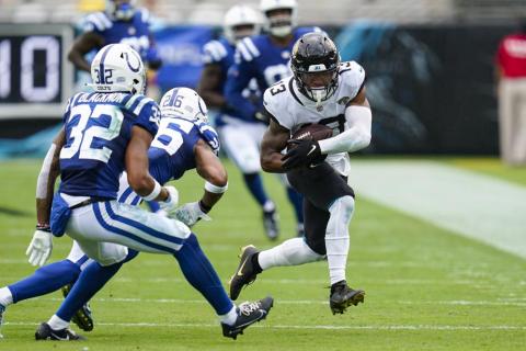 Jacksonville Jaguars wide receiver Christian Kirk (13) tries to get past Indianapolis Colts safeties Julian Blackmon (32) and Rodney McLeod (26) during Sunday's game in Jacksonville. (JOHN RAOUX/Associated Press)