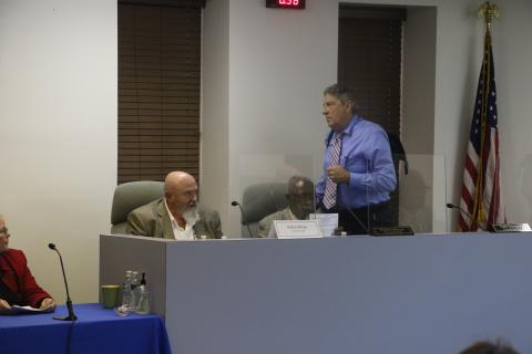 Councilman Todd Sampson leaves the dais as City Manager Paul Dyal speaks near the end of the Lake City Council meeting Tuesday. Sampson would return to his seat to respond to Dyal. (MORGAN MCMULLEN/Lake City Reporter)