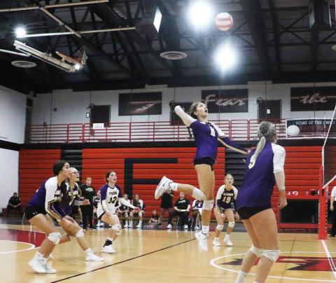 Columbia’s Sinei Wood rises to slam a shot against Fort White on Thursday. (MORGAN MCMULLEN/Lake City Reporter)