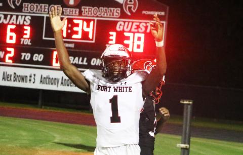 Fort White fullback Maliki Clark celebrates after scoring a touchdown against Hamilton County on Friday. (MORGAN MCMULLEN/Lake City Reporter)