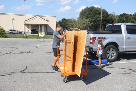 Bryce Lay loads up plywood at Home Depot on Monday as he makes preparations for Hurricane Ian. (MORGAN MCMULLEN/Lake City Reporter)