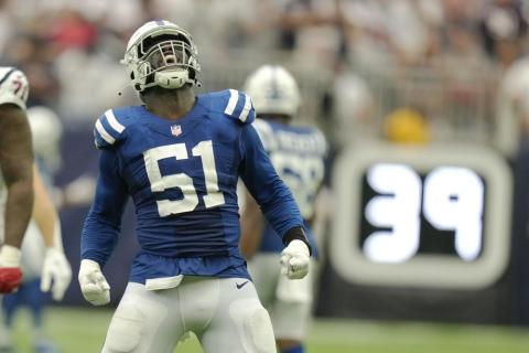 Indianapolis Colts defensive end Kwity Paye celebrates a sack of Houston Texans quarterback Davis Mills in overtime of Sunday's game in Houston. (ERIC CHRISTIAN SMITH/Associated Press)