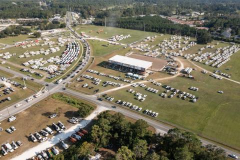 Utility crews from across the country poured into the Florida Gateway Fairgrounds at a Florida Power & Light processing site Monday in preparation for emergency response efforts for Hurricane Ian. (RAY CARPENTER/Special to the Reporter)