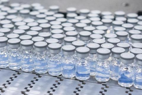 This August 2022 photo provided by Pfizer shows vials of the company’s updated covid-19 vaccine during production in Kalamazoo, Mich. (COURTESY/Pfizer via AP)