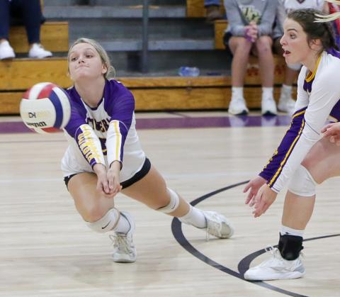 Columbia’s Madison Glenn dives for the ball while Savannah Bailey looks on during Thursday’s match against Dixie County. (BRENT KUYKENDALL/Lake City Reporter)
