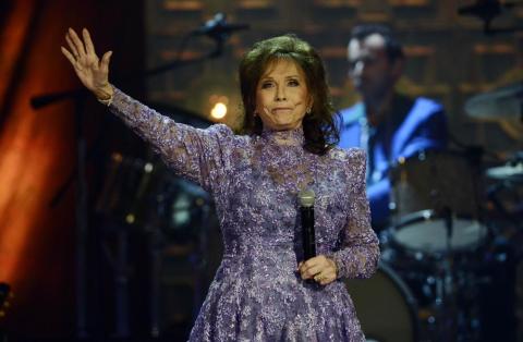 Loretta Lynn waves to the crowd after performing during the Americana Music Honors and Awards show Sept. 17, 2014. She died Tuesday at her home. She was 90. (MARK ZALESKI/Associated Press)