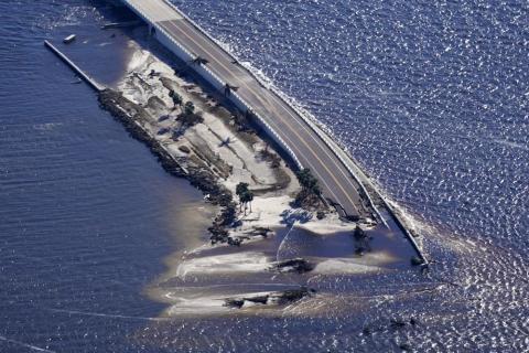 In this aerial photo made in a flight provided by mediccorps.org, damage from Hurricane Ian is seen on the causeway leading to Sanibel Island from Fort Myers on Sept. 30. (GERALD HERBERT/AP File)