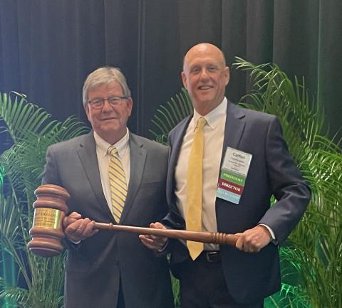 Jimmy Bielling (left) accepts the Florida Forestry Association’s presidential gavel from Carlton Jones. (COURTESY)