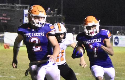 Branford receiver Arkayvion Jones (7) rushes up the field while running back Caden Coker (2) looks to block against Trenton last Friday. (ROB WOLFE/Special to the Reporter)