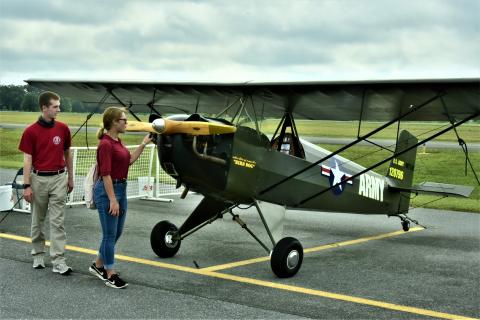 People look over an airplane at last year’s Wings Over Suwannee event at the Suwannee County Airport. The fly-in festival, which is in its seventh year, returns today and Saturday. (FILE)