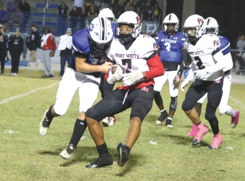 Fort White defensive back Tafari Moe runs after an interception against Ridgeview last Friday. (MORGAN MCMULLEN/Lake City Reporter)