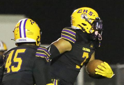 Columbia safety Amare Ferrell returns an interception for a touchdown against Gadsden County on Friday. (BRENT KUYKENDALL/Lake City Reporter)