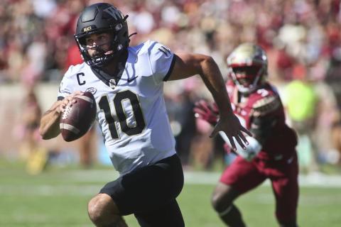 Wake Forest quarterback Sam Hartman runs out of the pocket against Florida State on Saturday in Tallahassee. (PHIL SEARS/Associated Press)