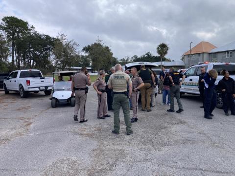 Different law enforcement agencies gather during Friday’s pursuit. (COURTESY)