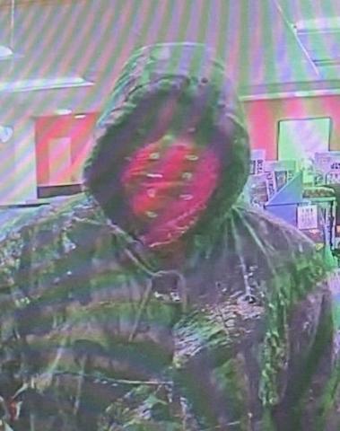 A masked man in camouflaged demanded money early Friday morning in a robbery at the Circle K at the intersection of West Duval Street and SW Baya Drive. (COURTESY) 
