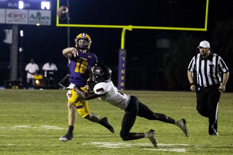 Columbia quarterback Evan Umstead throws a pass out of defensive pressure against Middleburg on Friday. (JEN CHASTEEN/Special to the Reporter)