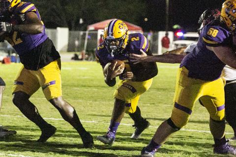 Columbia running back Tony Fulton hits the hole against Middleburg last Friday. (JEN CHASTEEN/Special to the Reporter)