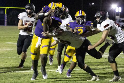 Columbia quarterback Tyler Jefferson (1) tries to avoid a tackle as he scrambles down the field against Middleburg on Friday. (JEN CHASTEEN/Special to the Reporter)