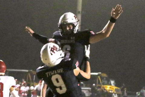 Fort White quarterback Clayton Philpot (6) celebrates with tight end Avery Giddens (9) after scoring on a touchdown run against Lafayette last Friday. (MORGAN MCMULLEN/Lake City Reporter)