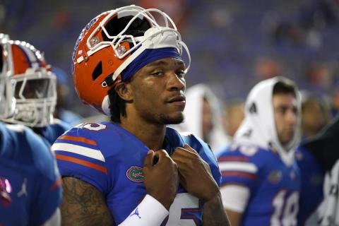 Florida quarterback Anthony Richardson gathers with teammates as the band plays the school's fight song after Florida was defeated by LSU on Oct. 15 in Gainesville. (JOHN RAOUX/Associated Press)