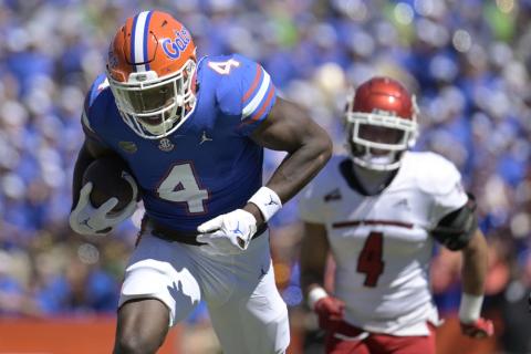 Florida wide receiver Justin Shorter runs to the end zone for a 75-yard touchdown on a reception in front of Eastern Washington defensive back Anthany Smith during Sunday's game in Gainesville. (PHELAN M. EBENHACK)