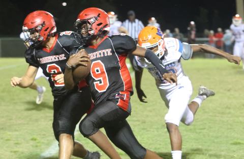 Lafayette quarterback Tywan Williamson rushes for a touchdown against Branford on Monday night. (PAUL BUCHANAN/Special to the Reporter)