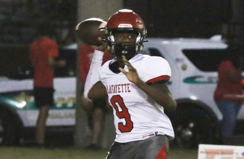 Lafayette quarterback Tywan Williamson sets to throw a pass against Fort White last Friday. (MORGAN MCMULLEN/Lake City Reporter)