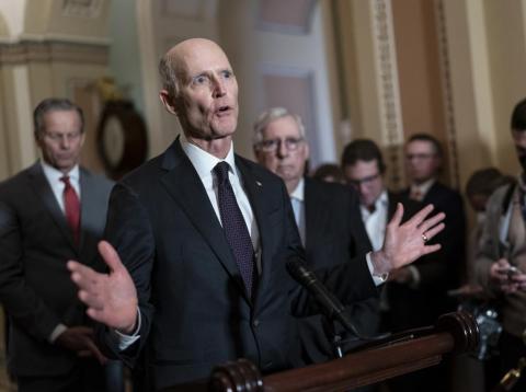 Sen. Rick Scott, R-Fla., speaks as Senate Minority Leader Mitch McConnell, R-Ky., listens at right during a news conference at the Capitol in Washington. (J. SCOTT APPLEWHITE/AP File)