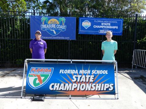 Columbia head coach Shawn Rost (left) and swimmer Ian Disosway (right) at the Class 3A state meet on Friday. (COURTESY)