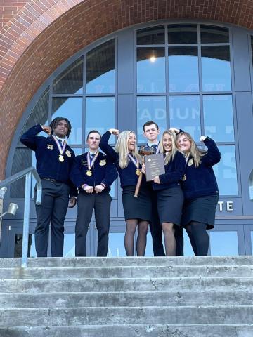 The national champion Lafayette FFA parliamentary procedure team poses with its plaque outside Lucas Oil Stadium in Indianapolis last week. Team members include Seth Chandler, Jaley Moseley, McKenzie Winburn, Ella Hancock, Jalen Hill and Cason Driver. (COURTESY)