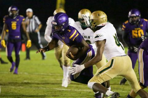 Columbia quarterback Tyler Jefferson scrambles for yardage against Lincoln in the Region 1-3S quarterfinals last Friday. (BRENT KUYKENDALL/Lake City Reporter)