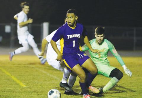 Columbia’s AJ Brinson looks to pass against Eastside last season. (FILE)